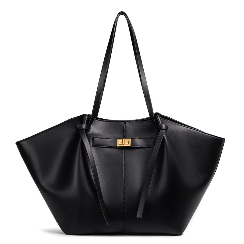 Black handbag with a gold clasp on a white background