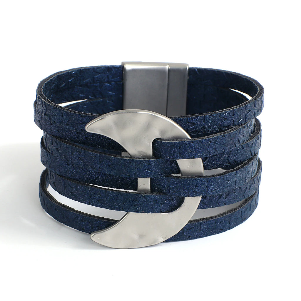 Blue leather bracelet with silver crescent moon charms on a white background