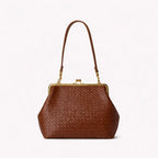 Brown woven handbag with a gold clasp on a white background