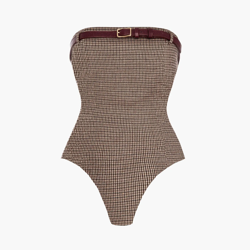 Brown houndstooth patterned strapless bodysuit with a belt on a white background