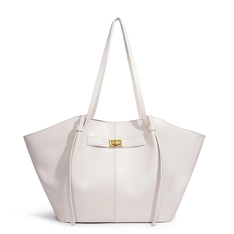 White handbag with a gold clasp on a white background
