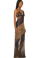 Model wearing a dress with leopard print and lace details on a white background