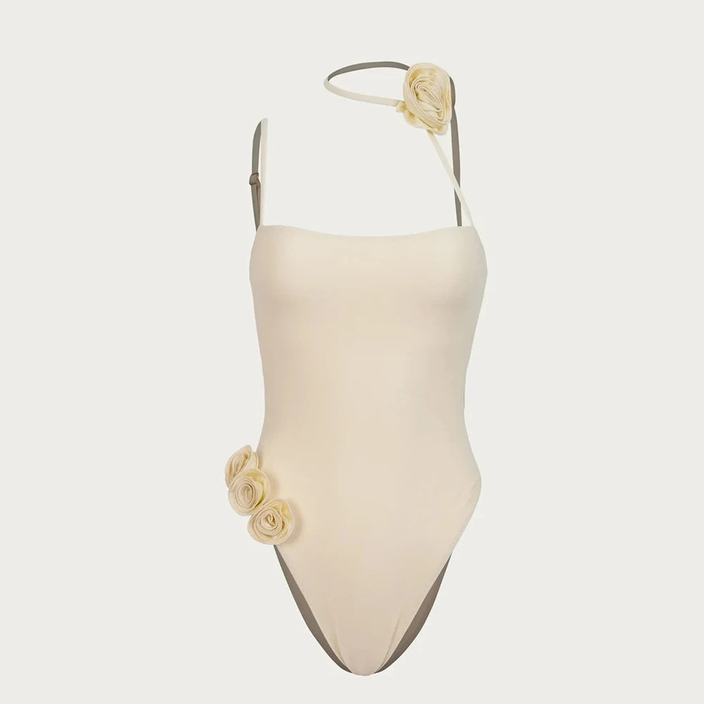 Beige swimsuit with floral details on a white background