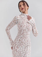 Woman wearing a white lace dress against a light gray background