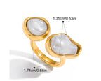 Gold ring with white stones on a white background