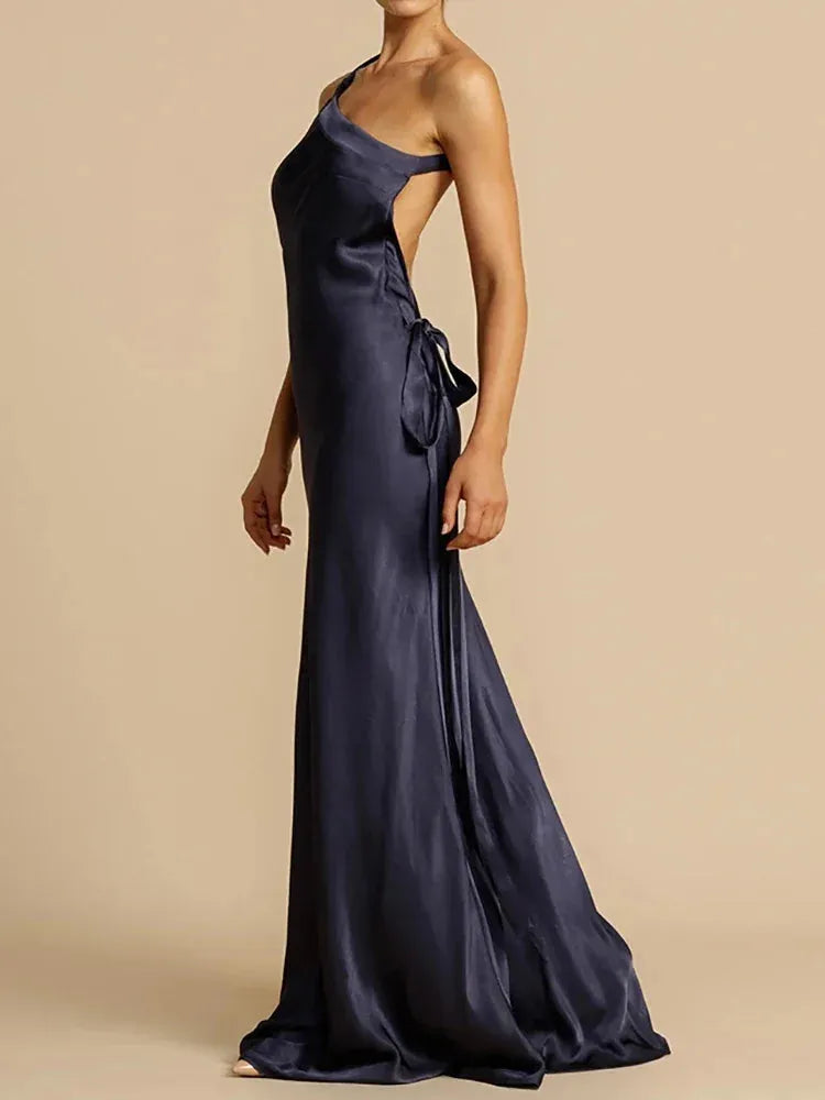 Navy blue evening gown on a neutral background
