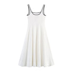 White sleeveless dress with black trim on a white background