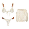 White lace bikini set with brown straps on a white background