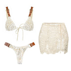 White lace bikini set with brown straps on a white background