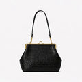 Black woven leather handbag with a gold kiss-lock frame and a single shoulder strap, shown on a plain white background.