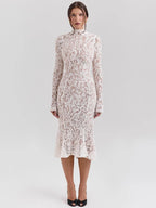 Woman wearing a white lace dress on a light gray background