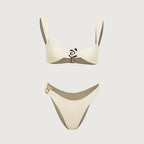 Beige bikini set on a light gray background