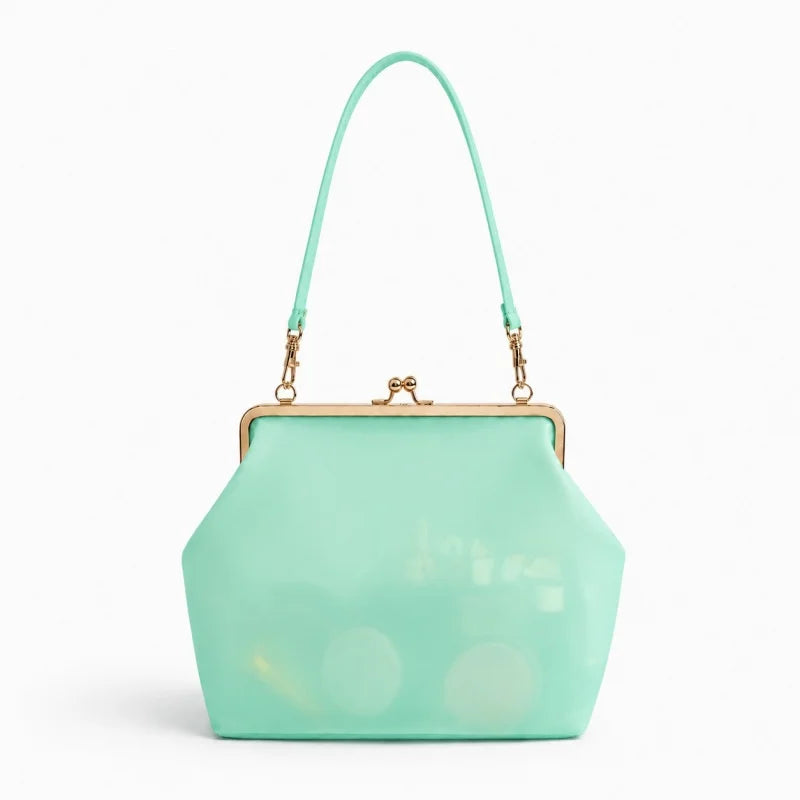 A mint green translucent handbag with a gold-tone kiss-lock frame and matching shoulder strap, shown on a clean white background.
