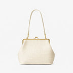 Cream-colored handbag with gold accents on a white background