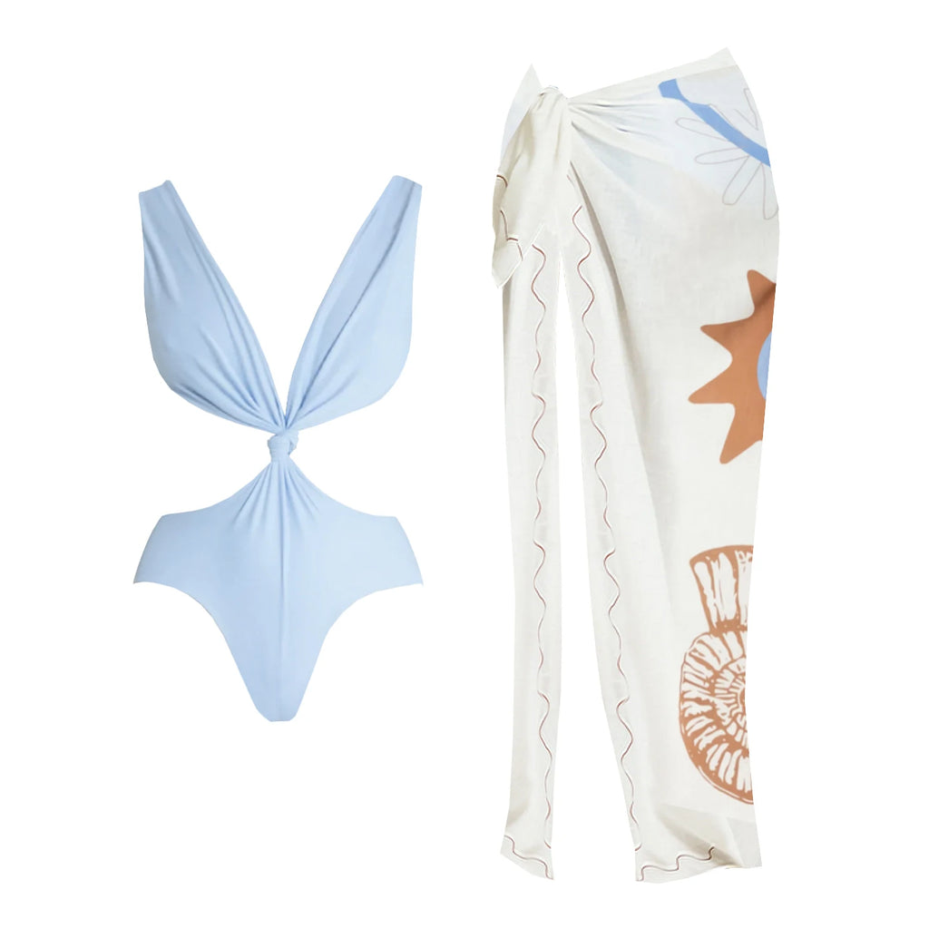 Light blue bikini top and white sarong with shell patterns on a white background