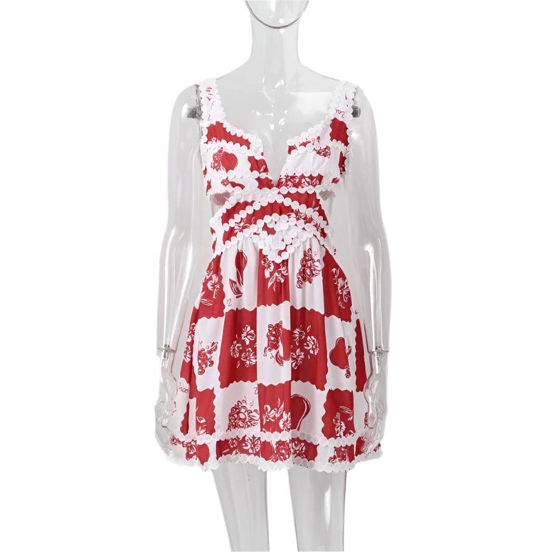 A woman wearing a red and white floral mini dress with a V-neck and sleeveless design, standing on a staircase.