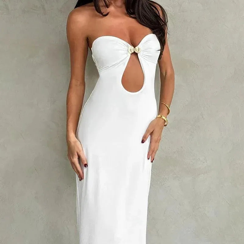White strapless dress with cutout back against a plain background