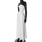 White strapless dress on a black mannequin against a white background
