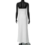 White dress on a black mannequin against a white background
