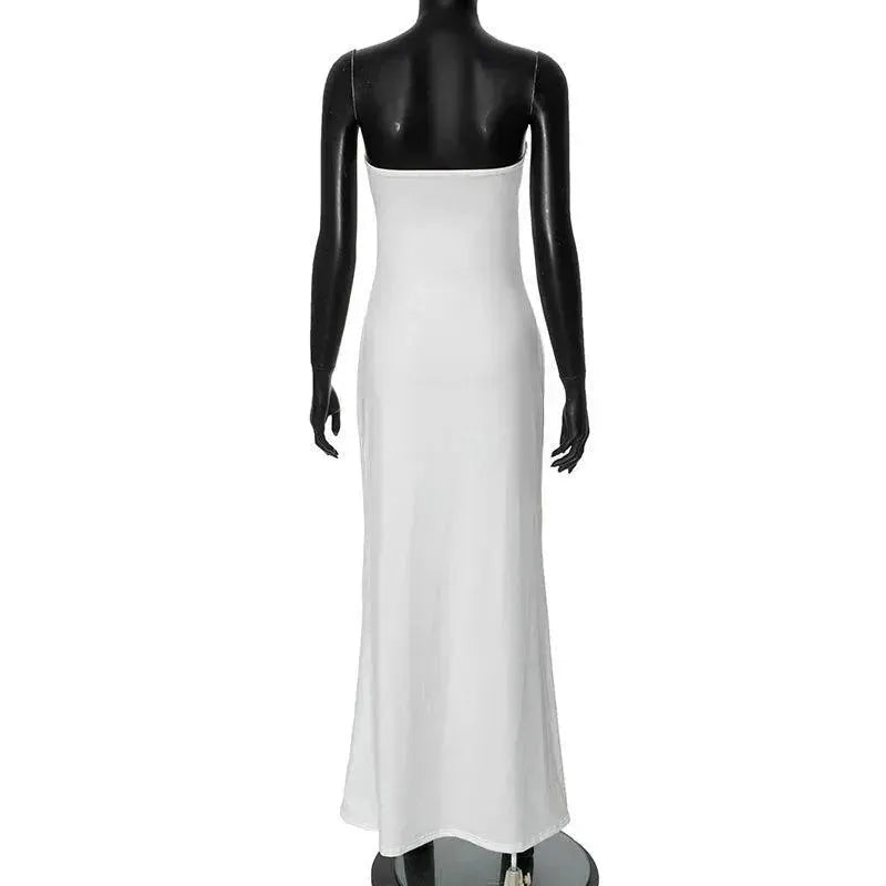 White dress on a black mannequin against a white background