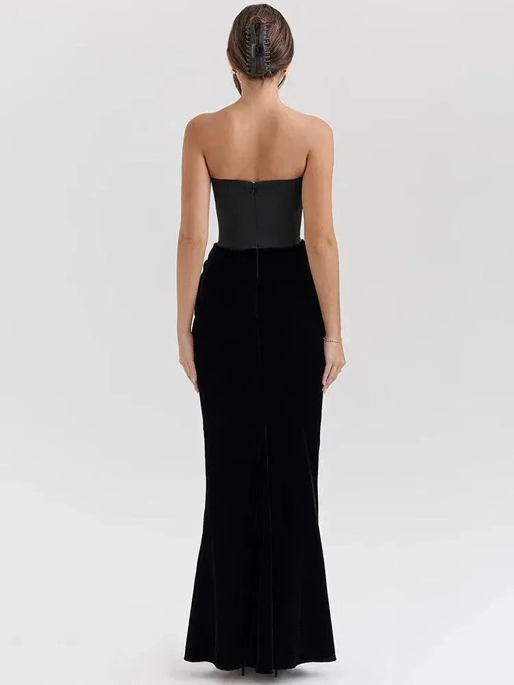 Black strapless evening gown on a model against a plain background.